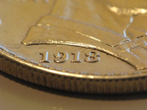 A closeup of a 1918 Lincoln commemorative silver dollar. Notice the detail? 