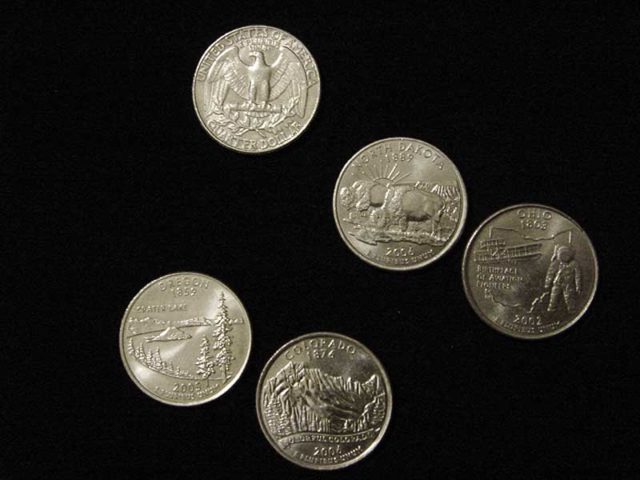 Copper-nickel clad coins, like these quarters, were first introduced to circulation in 1965. 
