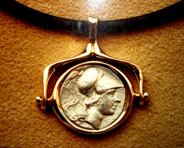 This ancient coin has been included as an element in a piece of jewelry and constitutes a form of coin art.