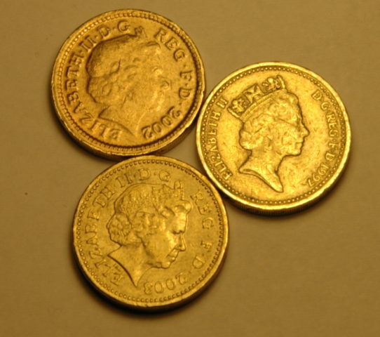 Can you spot the fake coin in this bunch of British pounds? Hint: many fake coins don't look as sharp as their real counterparts....Photo by JasonRogersFotographie on Flickr Can you spot the fake coin in this bunch of British pounds? Hint: many fake coins don't look as sharp as their real counterparts.