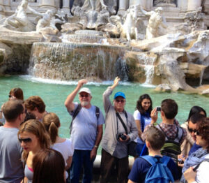 This group is tossing coins into the Trevi Fountain - perhaps the world's most famous coin tossing fountain. Photo by D&S McSpadden on Flickr. coins fountain