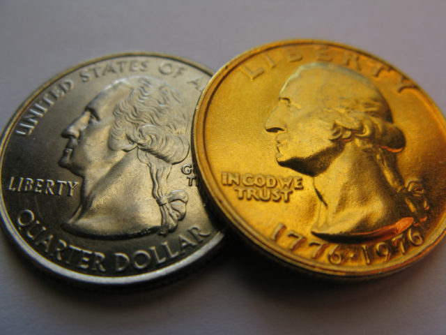 This gold Bicentennial quarter (right) sits next to a regular 50 States Quarter. 