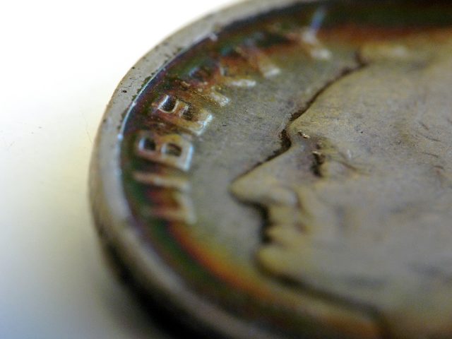 An old dime with patina. 