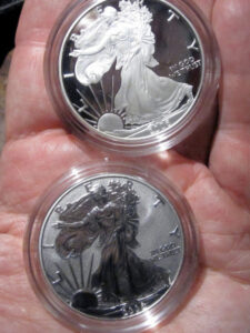 Adolph Weinman's Walking Liberty design is seen here on these 2 American Silver Eagle coins. photo by sirqitous on Flickr. Walking Liberty Half Dollar American Silver Eagle coins
