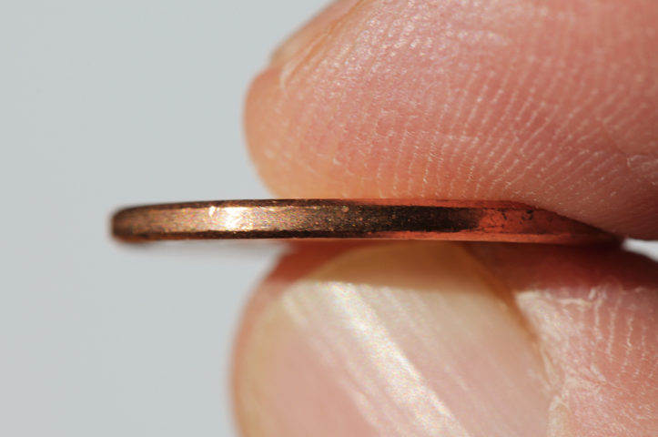 A closeup of the smooth edge of a penny. It's helpful to give potential buyers what the edges of your coins look like. photo by theilr on Flickr