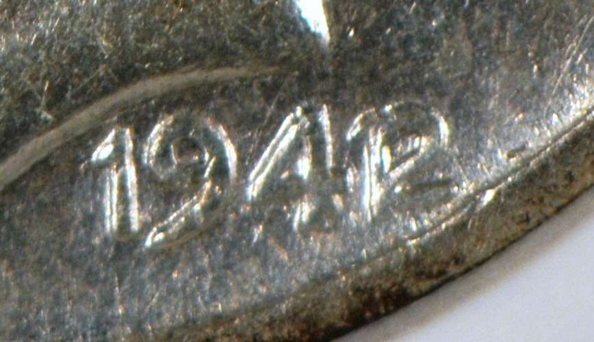 Closeup of a rare 1942/1 Mercury dime. photo by NorthernLightsNumismatics on Flickr Closeup of a rare 1942/1 Mercury dime.