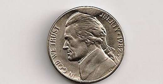 The raised blob of metal near the 12 o clock and 1 o clock positions on this nickel is a die cud. photo by economic realist on Wikimedia Commons. This is an example of a Die Cud coin -- an error coin with bubbles.