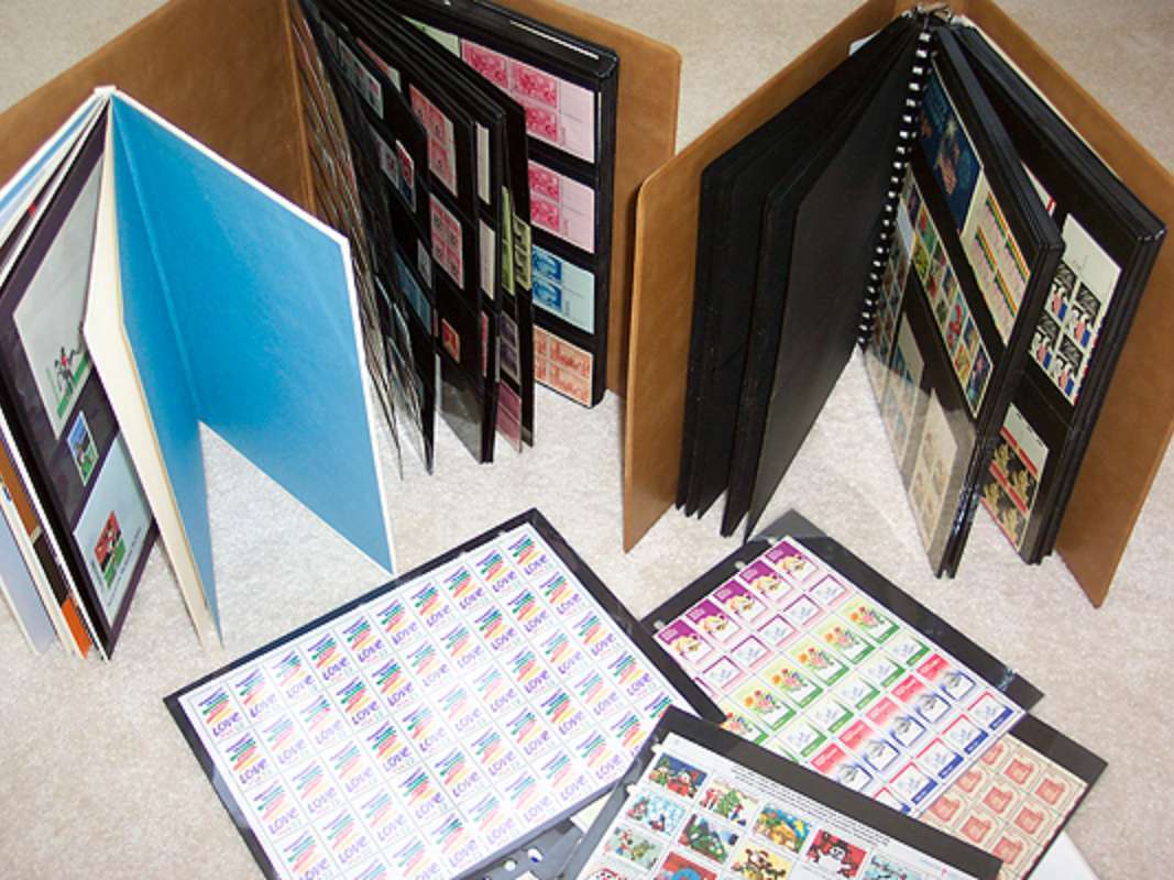 My stamp collection. I have SEVERAL more notebooks like these filled with brand new U.S. postage stamps! photo by Lynnette at TheFunTimesGuide.com My stamp collection. I have SEVERAL more notebooks like these filled with brand new U.S. postage stamps!