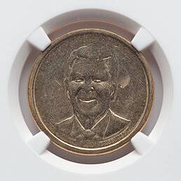 This is a Ronald Reagan $1 Presidential dollar coin with a Struckthrough error.  