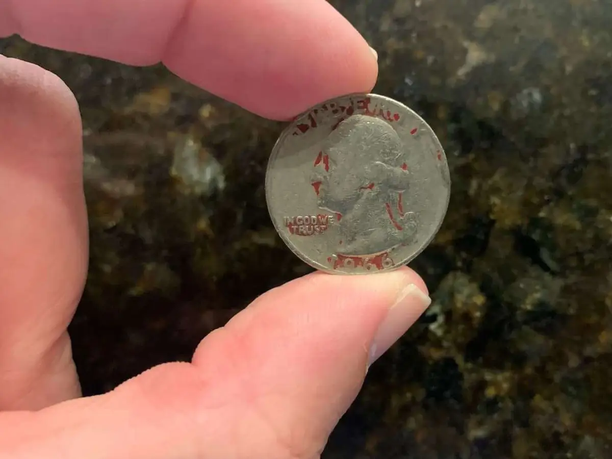 The mystery behind the red quarter has been solved! Here's what red quarters mean and how much they're worth.